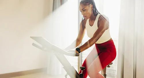 Black female athlete crushes cardio with home workout